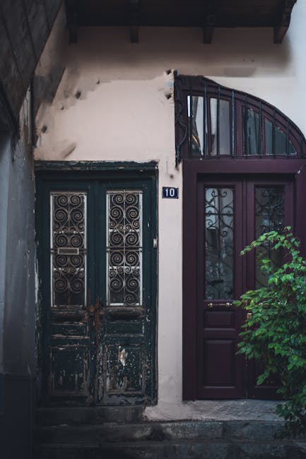 Ornate black decorative entrance doors labeled with number 10